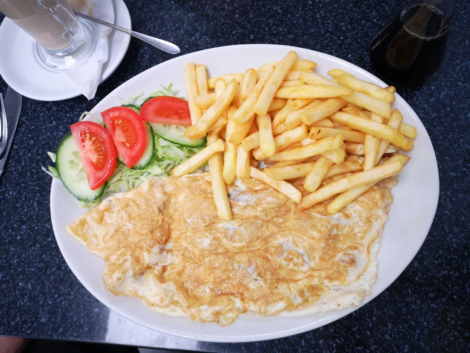 A plain omelette with chips and a side salad at Station Cafe
